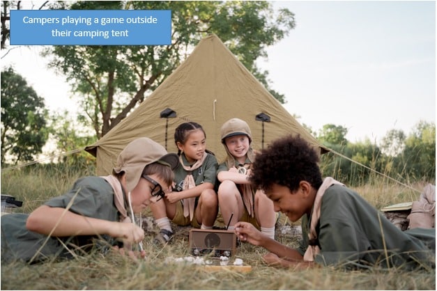 Campers playing a game outside their camping tent